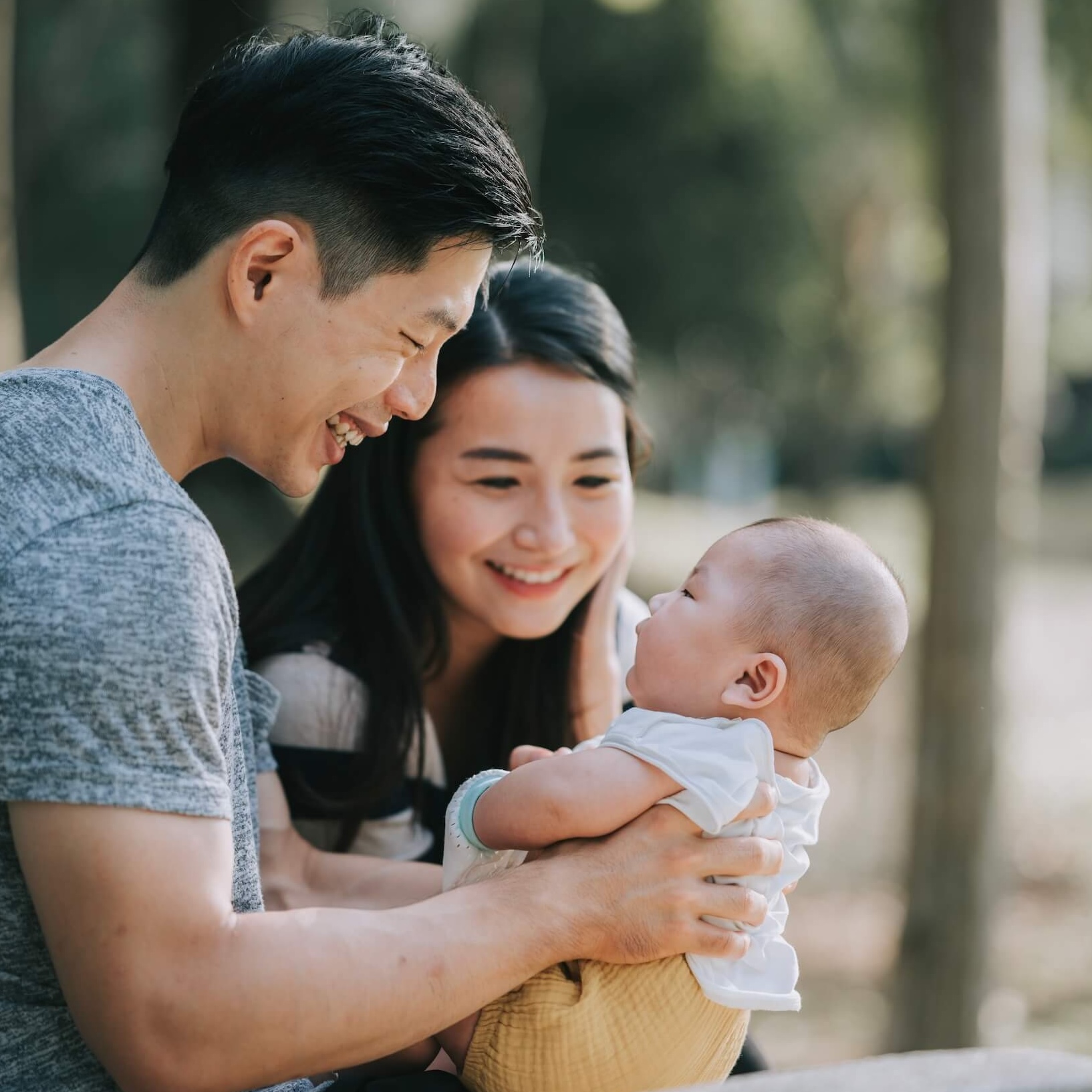 Asian couple with small baby